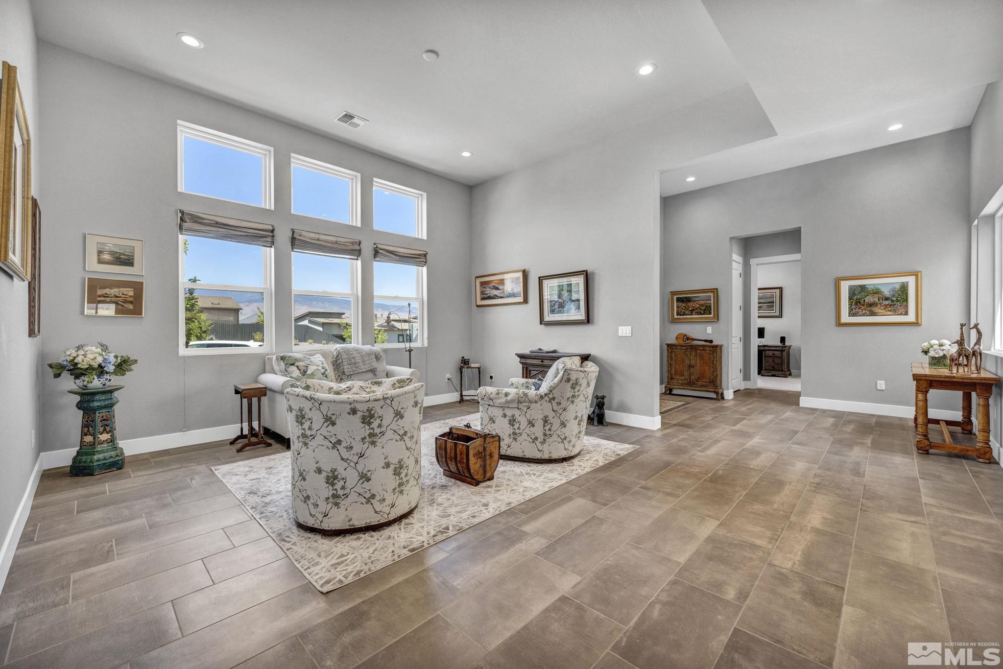 14028 Prairie Land Way Reno, NV 89521 - Photo 22 of 39 a living room with furniture large window and a table