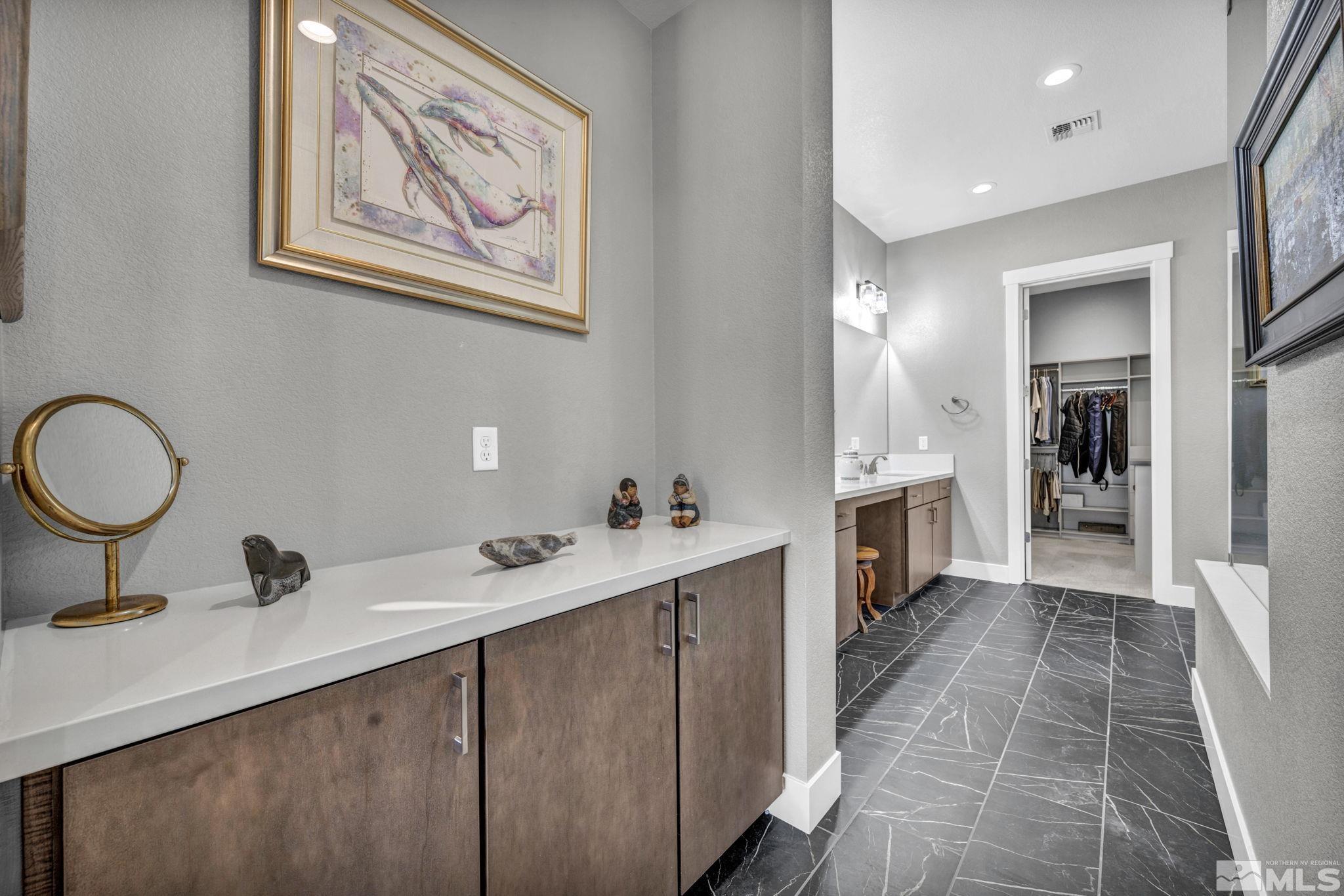 14028 Prairie Land Way Reno, NV 89521 - Photo 26 of 39 a bathroom with double vanity sink and a mirror