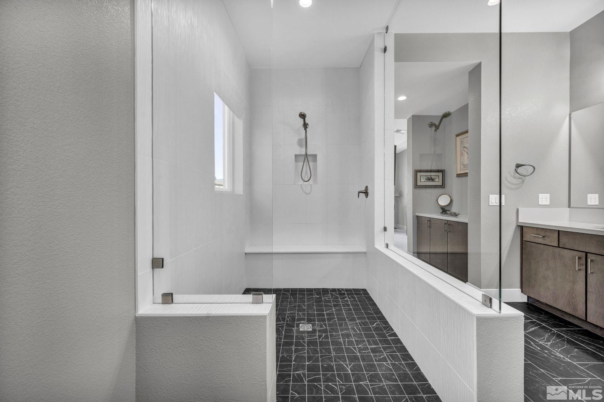 14028 Prairie Land Way Reno, NV 89521 - Photo 27 of 39 a bathroom with a bathtub and a shower