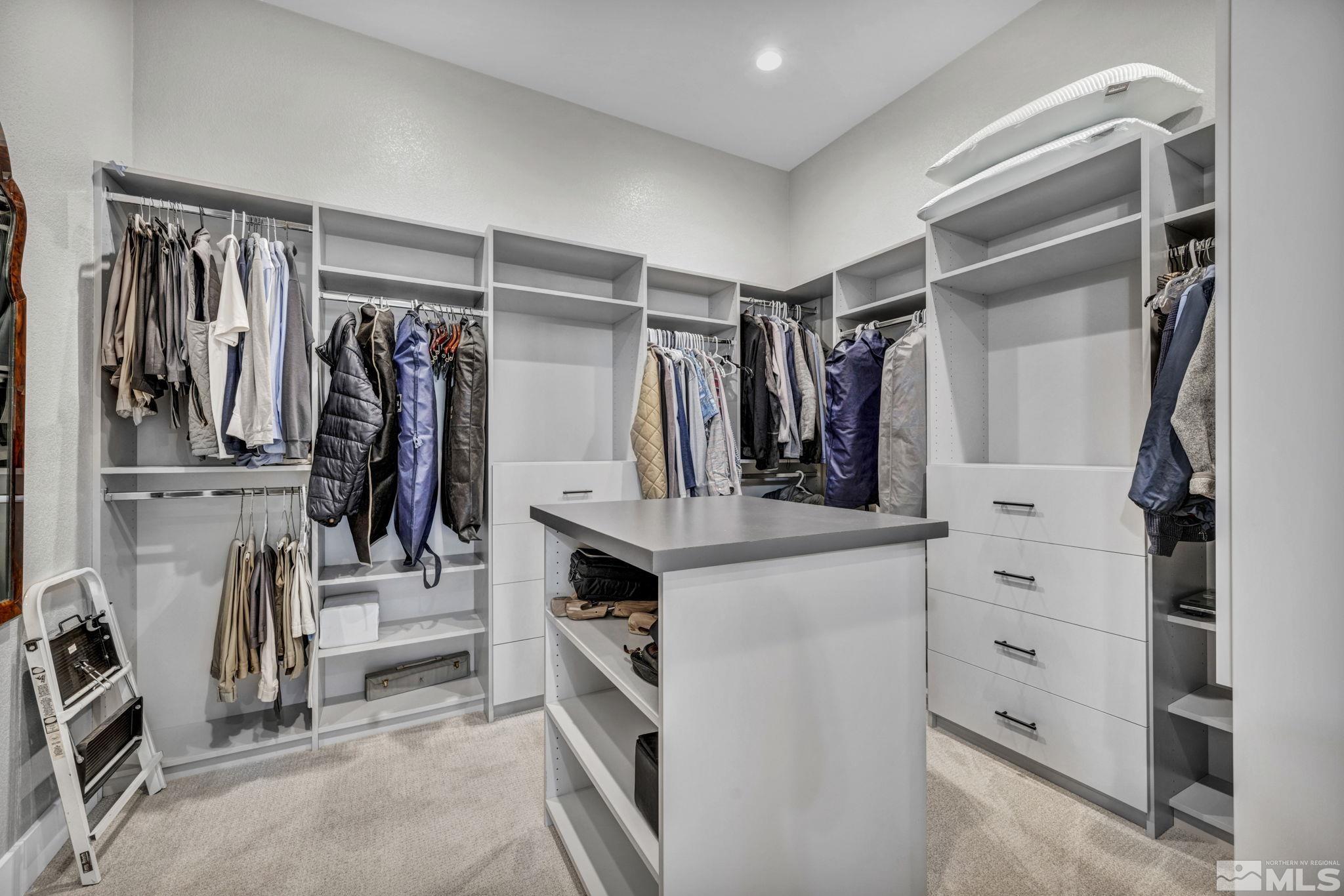 14028 Prairie Land Way Reno, NV 89521 - Photo 28 of 39 a view of walk in closet with clothes and shoes