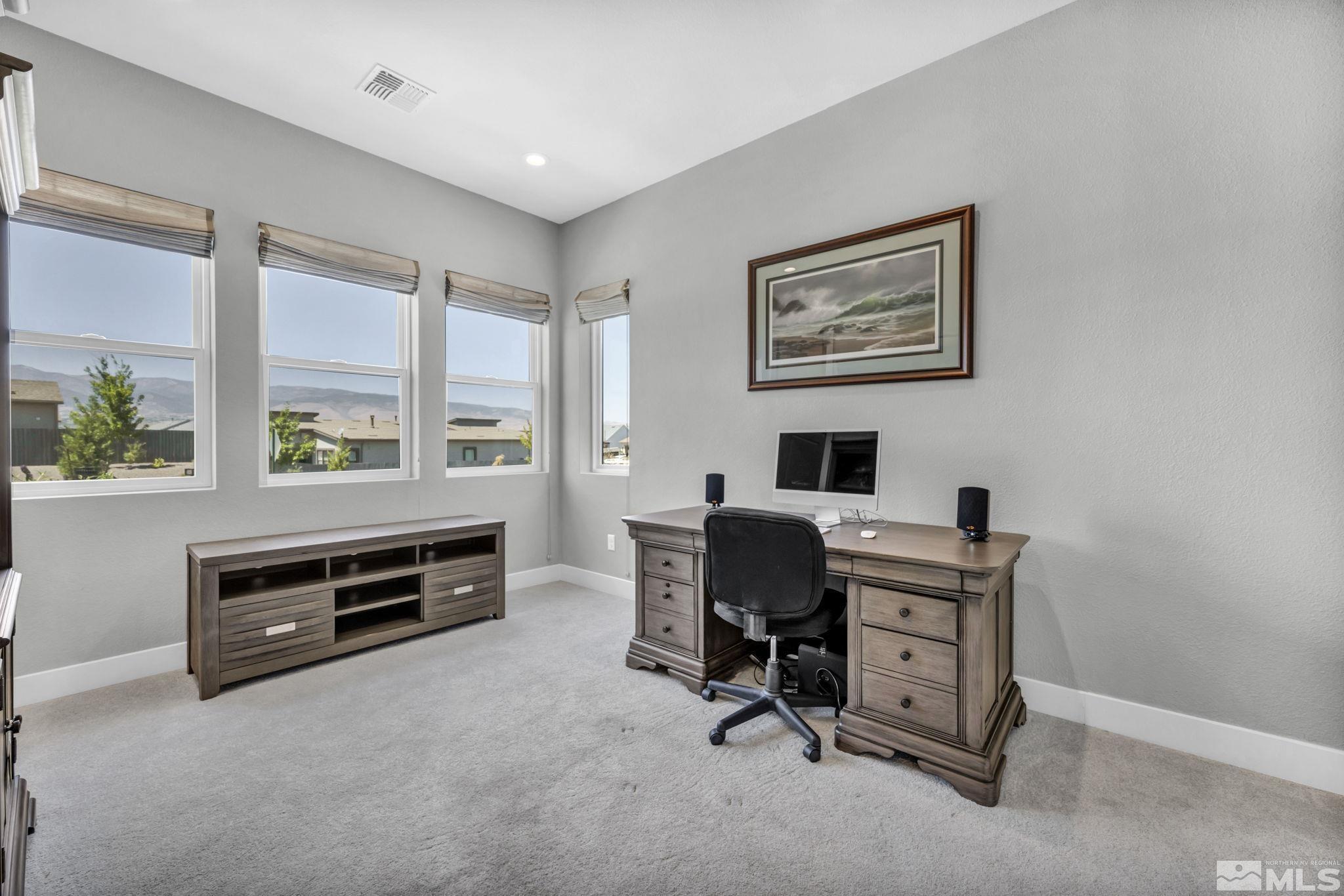 14028 Prairie Land Way Reno, NV 89521 - Photo 29 of 39 a view of a workspace with furniture and a window