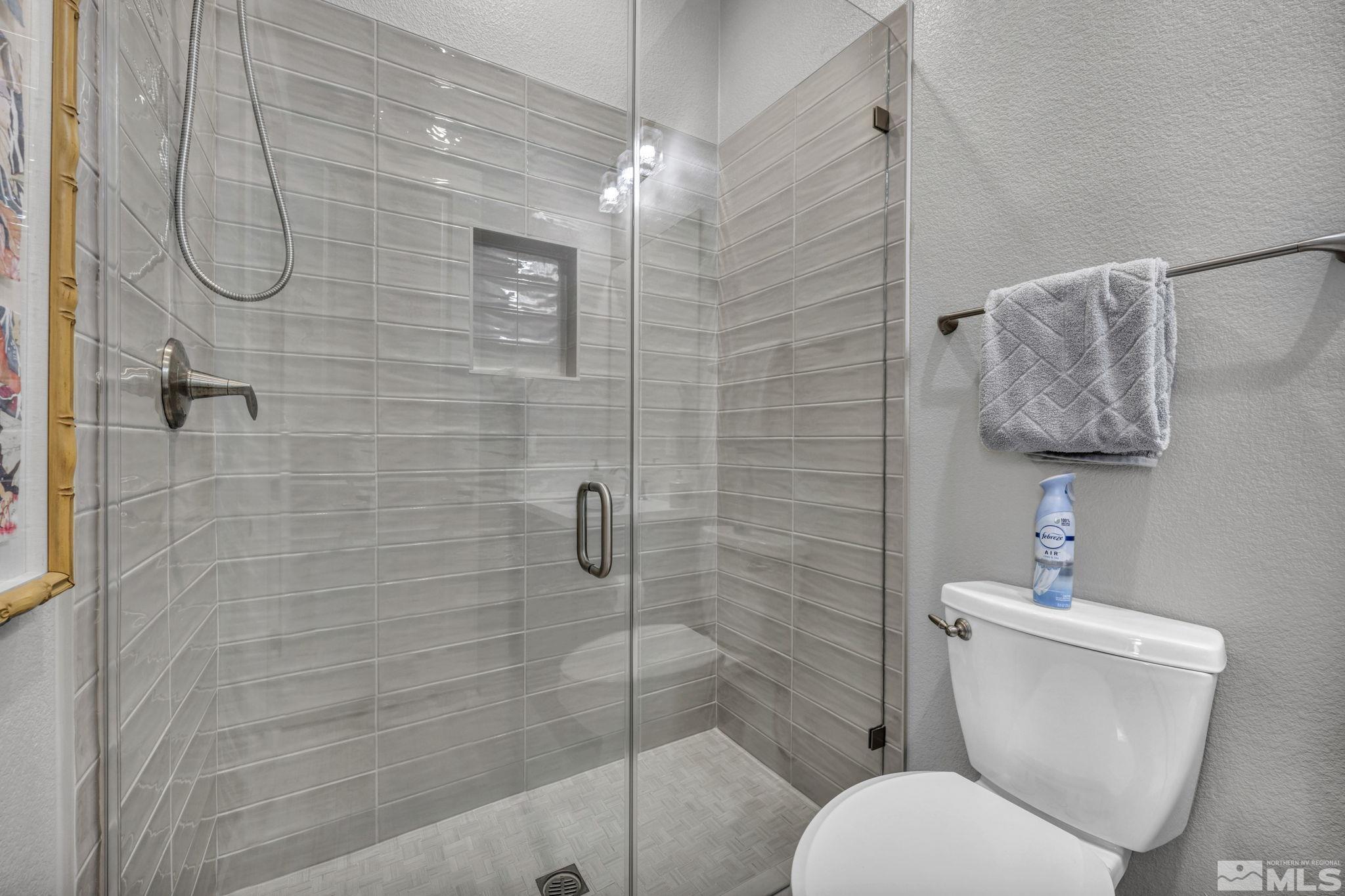14028 Prairie Land Way Reno, NV 89521 - Photo 33 of 39 a bathroom with a toilet sink and shower