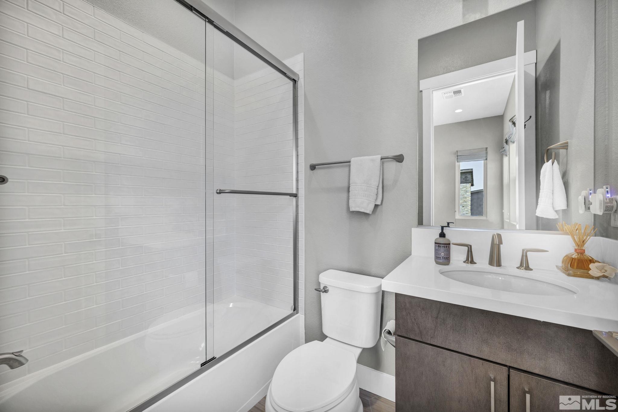 14028 Prairie Land Way Reno, NV 89521 - Photo 38 of 39 a bathroom with a toilet sink and shower