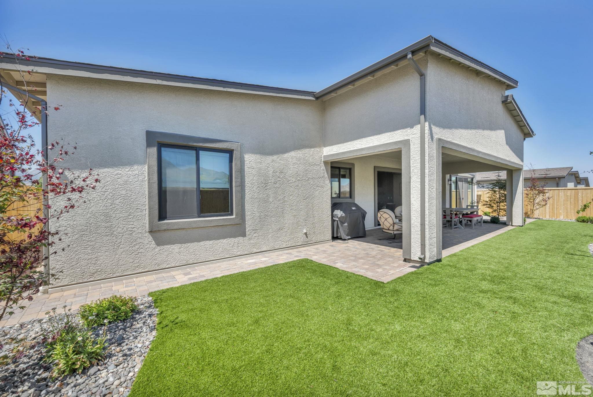 14028 Prairie Land Way Reno, NV 89521 - Photo 4 of 39 a view of an house with backyard porch and entertaining space