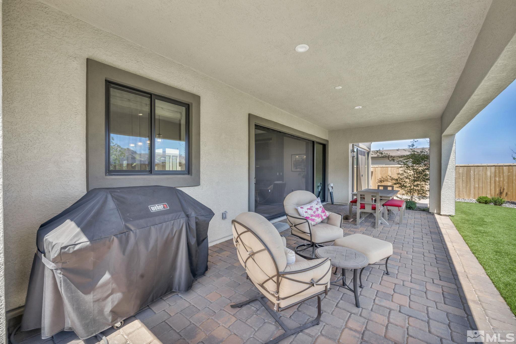 14028 Prairie Land Way Reno, NV 89521 - Photo 5 of 39 a living room filled with furniture and a table