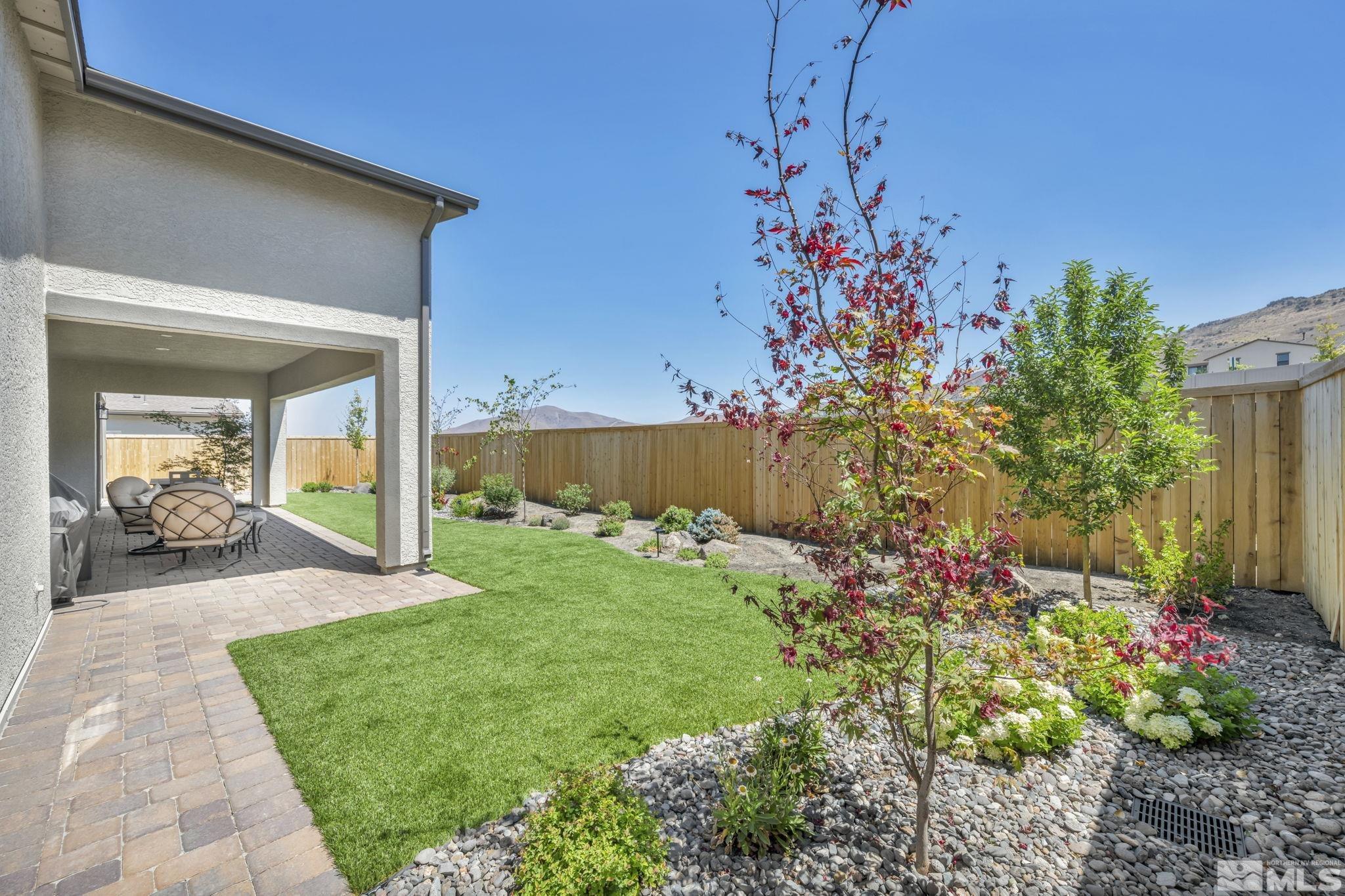 14028 Prairie Land Way Reno, NV 89521 - Photo 6 of 39 a view of a house with a yard and garden