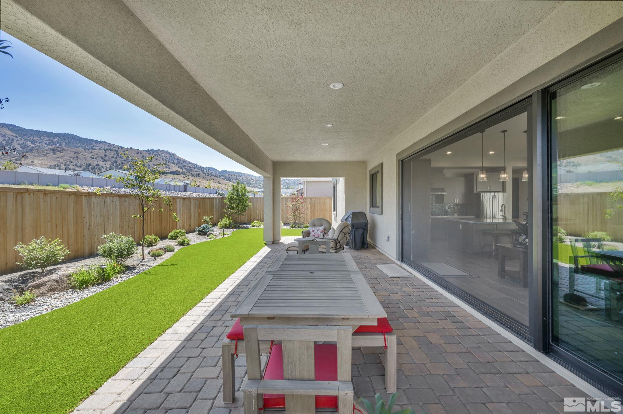 14028 Prairie Land Way Reno, NV 89521 - Photo 7 of 39 a front view of a house with a yard