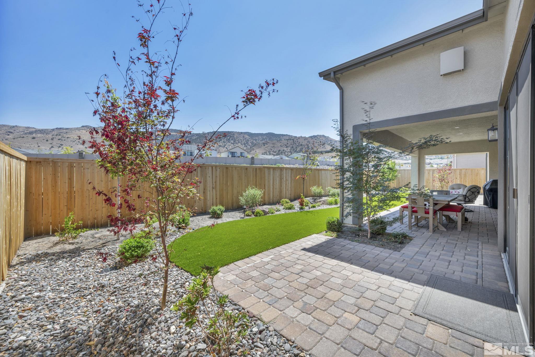 14028 Prairie Land Way Reno, NV 89521 - Photo 8 of 39 a view of a backyard with plants and a patio