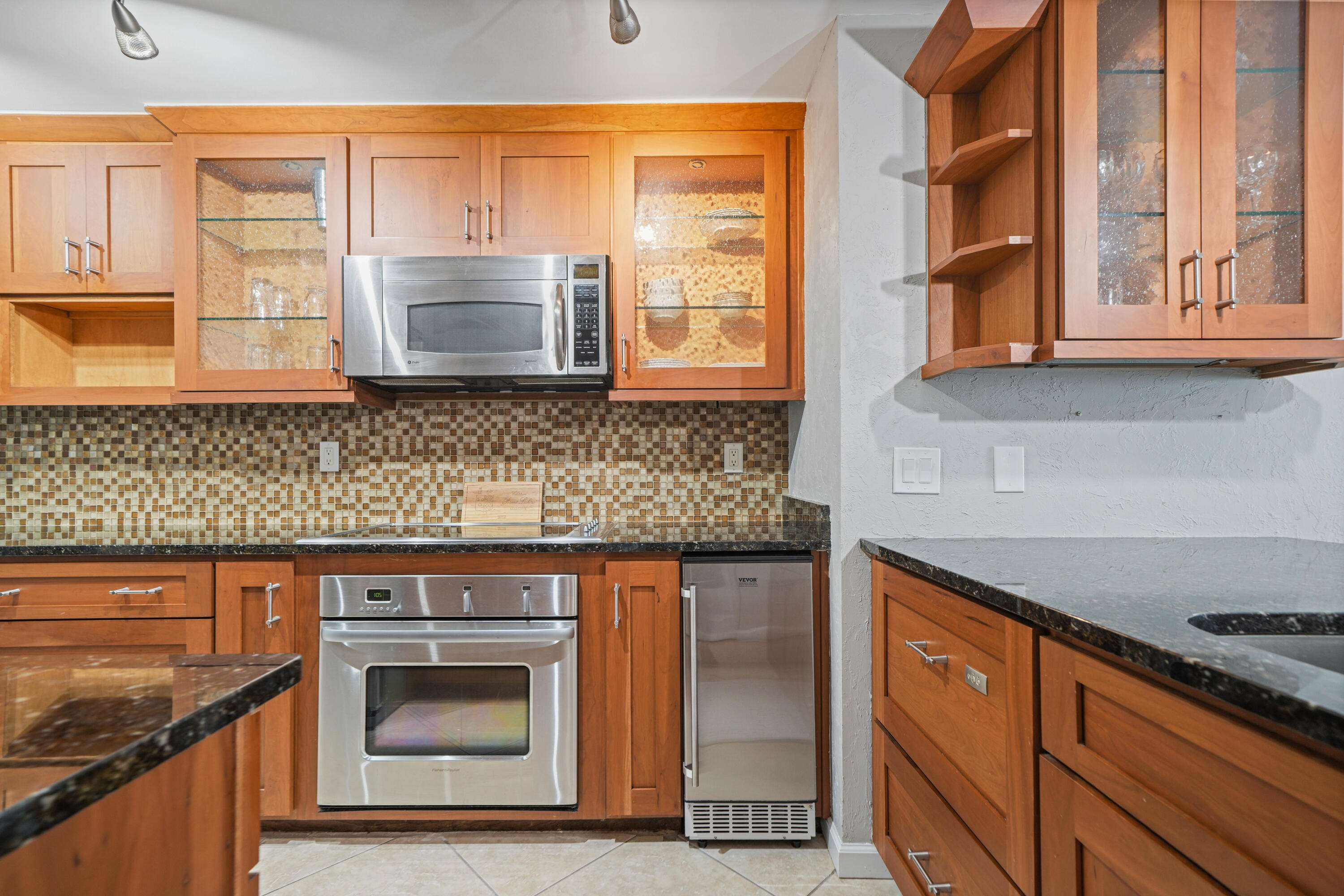 197 Durango Road, Unit 3D Destin, FL 32541 - Photo 11 of 43 a kitchen with stainless steel appliances granite countertop a stove and a sink