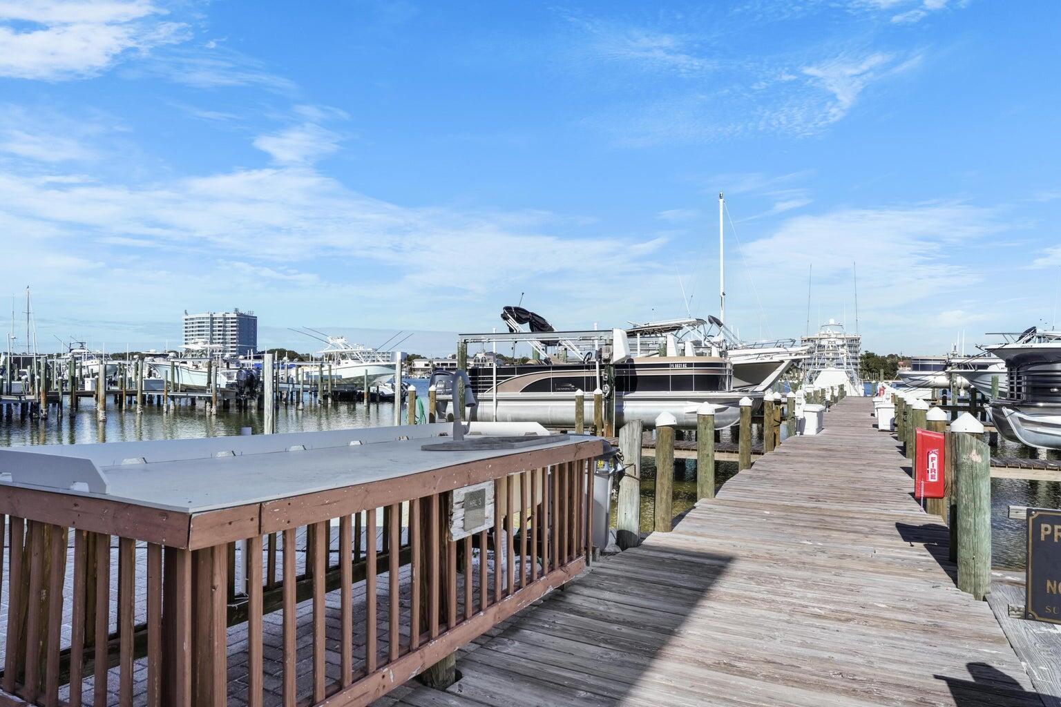 197 Durango Road, Unit 3D Destin, FL 32541 - Photo 23 of 43 a view of roof deck with two chairs and wooden floor