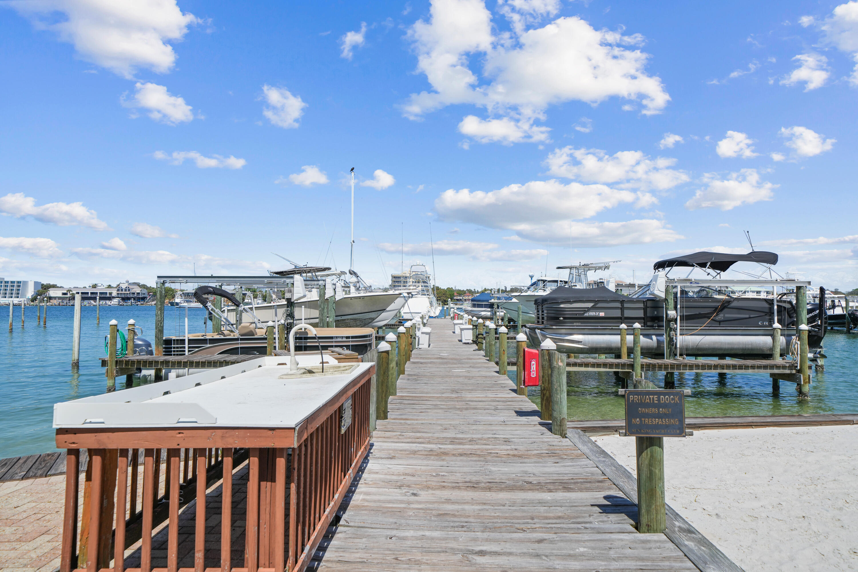 197 Durango Road, Unit 3D Destin, FL 32541 - Photo 31 of 43 a view of a rooftop deck with dining table and chairs
