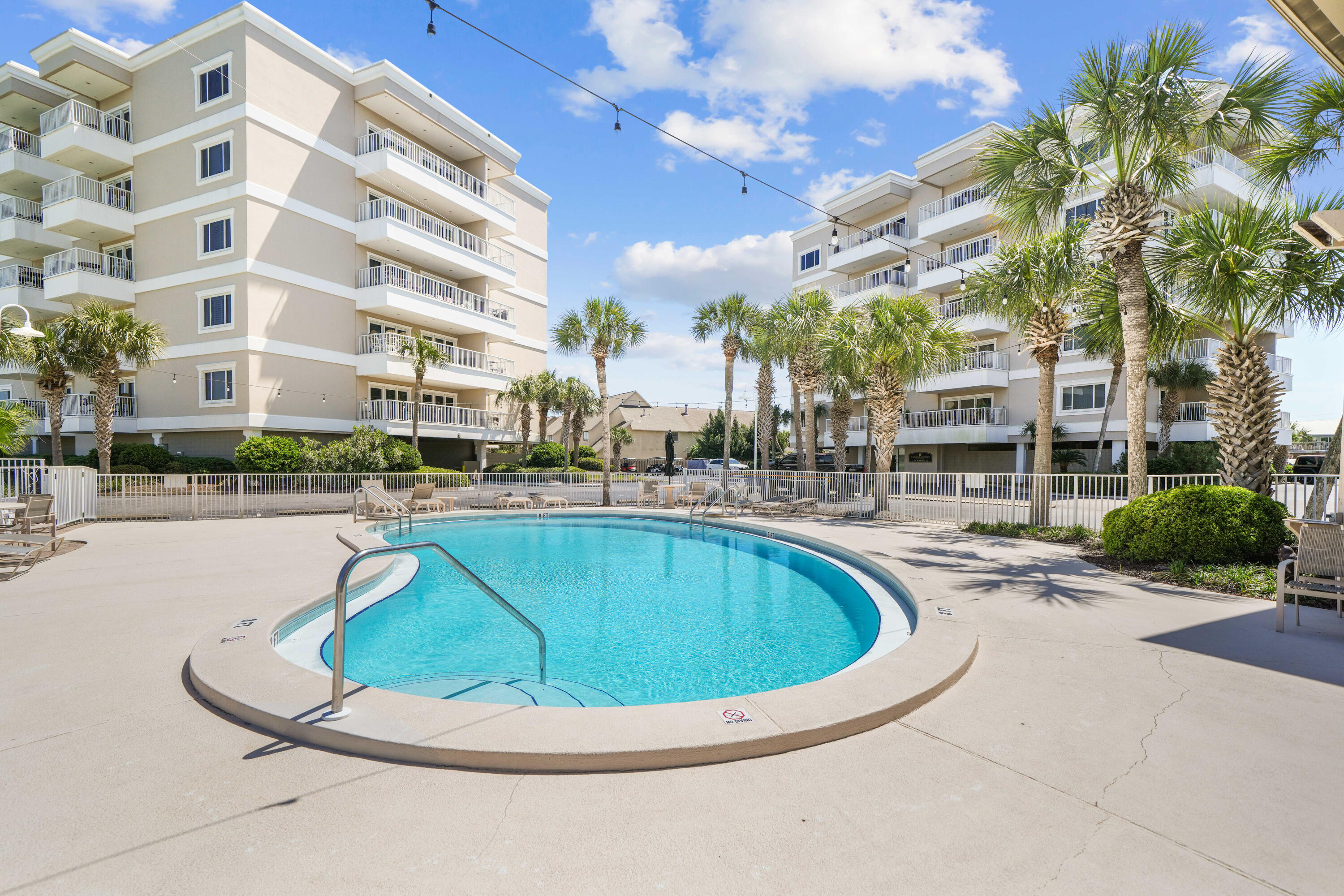 197 Durango Road, Unit 3D Destin, FL 32541 - Photo 32 of 43 a view of a swimming pool with outdoor seating