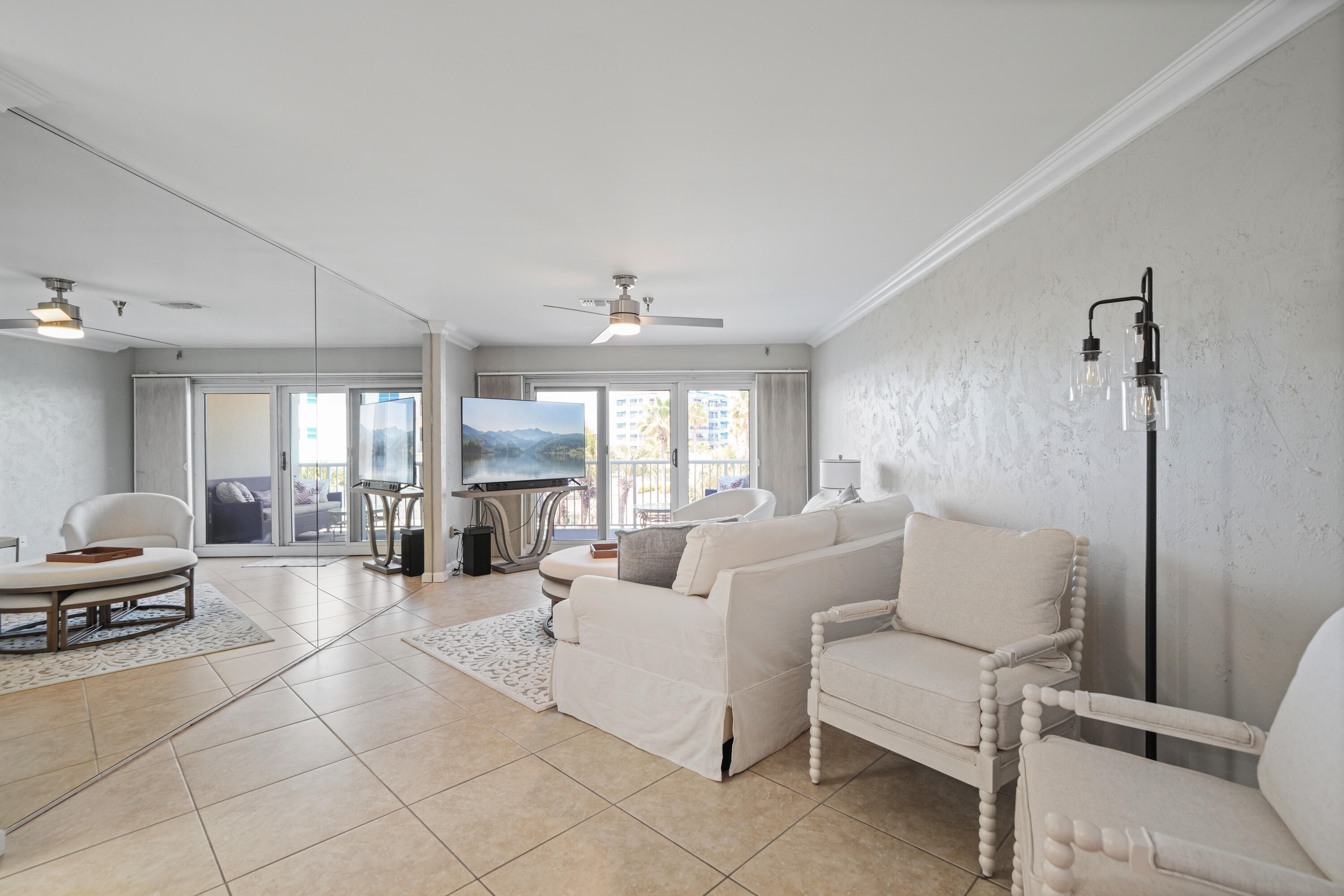 197 Durango Road, Unit 3D Destin, FL 32541 - Photo 6 of 43 a living room with furniture and a chandelier