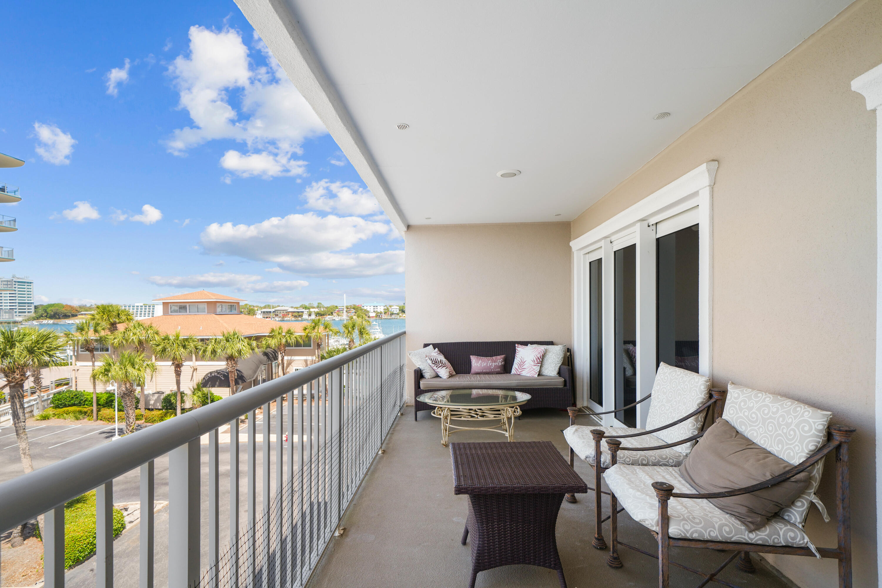 197 Durango Road, Unit 3D Destin, FL 32541 - Photo 7 of 43 a view of a chairs and table in a balcony