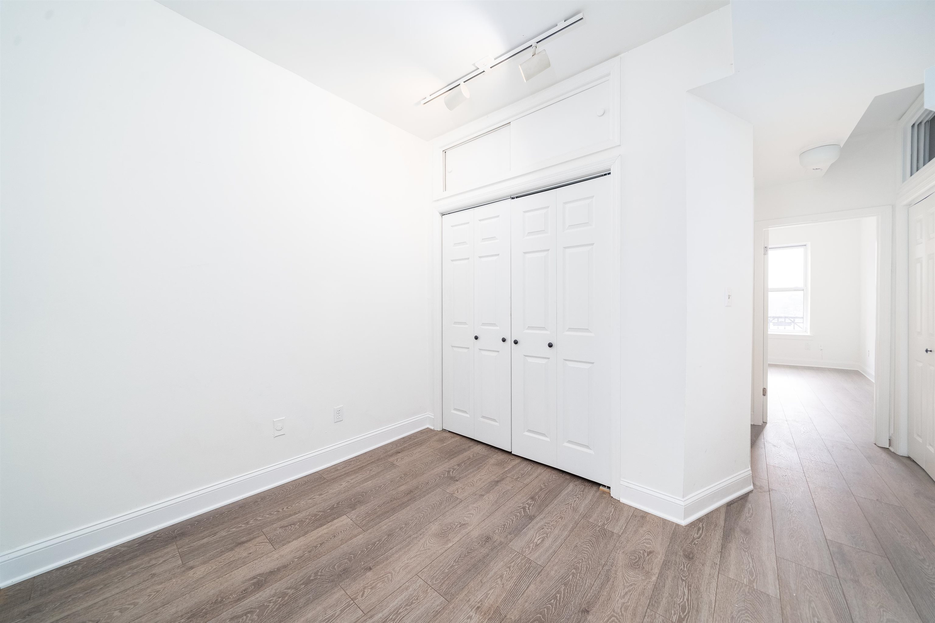 157 14th Street, Unit 5L Hoboken, NJ 07030 - Photo 5 of 11 a view of a room with wooden floor