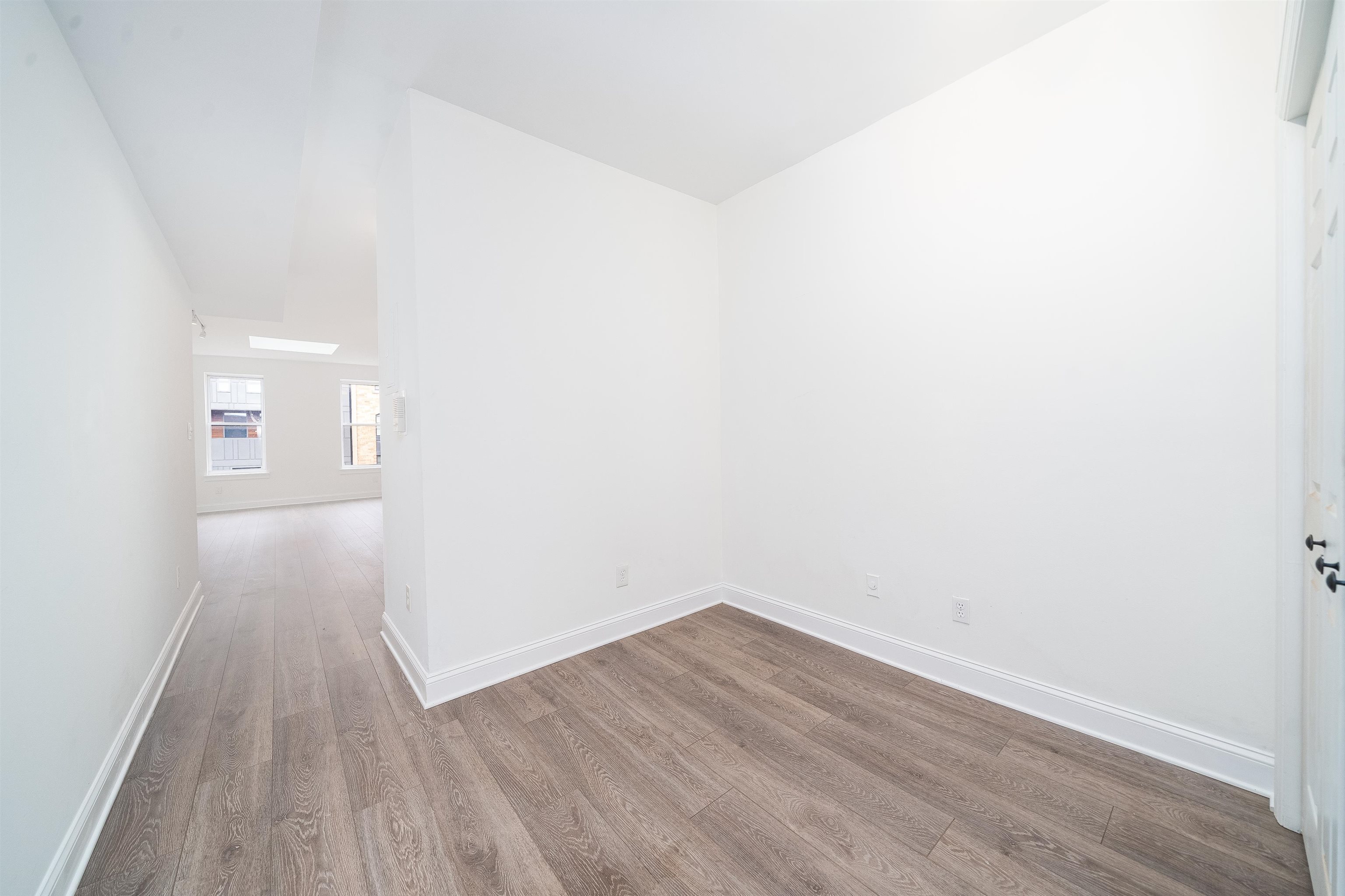 157 14th Street, Unit 5L Hoboken, NJ 07030 - Photo 6 of 11 a view of a room with wooden floor