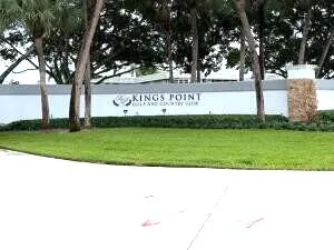 a view of a park with large trees