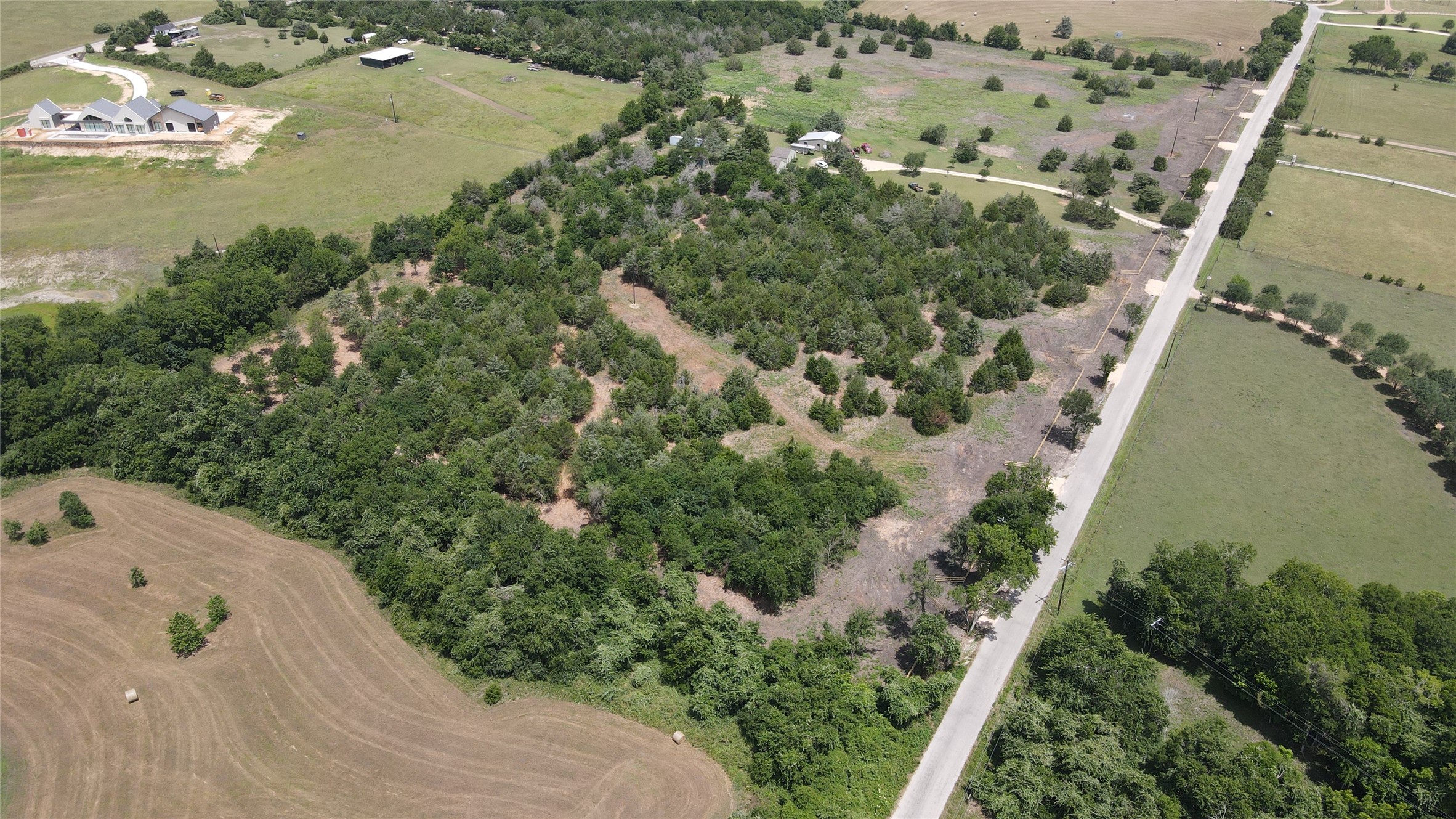 Lot 3 Wonder Hill Road Chappell Hill, TX 77426 - Photo 3 of 16 an aerial view of a house with a yard and lake view