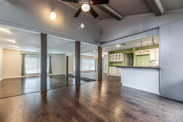 a view of an entryway with wooden floor