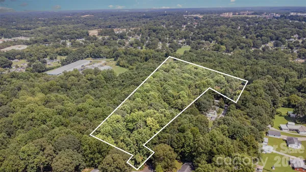 an aerial view of house with yard