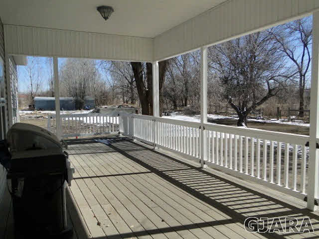 2501 Riata Ranch Road Grand Junction, CO 81505 - Photo 14 of 16 a view of a balcony with wooden floor