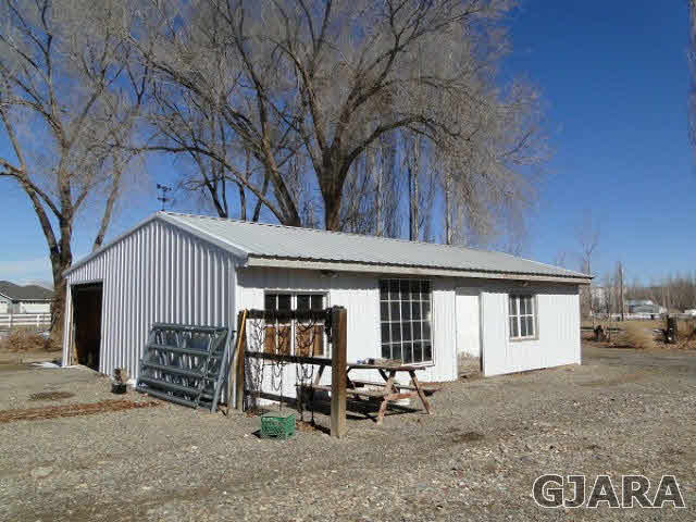2501 Riata Ranch Road Grand Junction, CO 81505 - Photo 16 of 16 a front view of a house with garden
