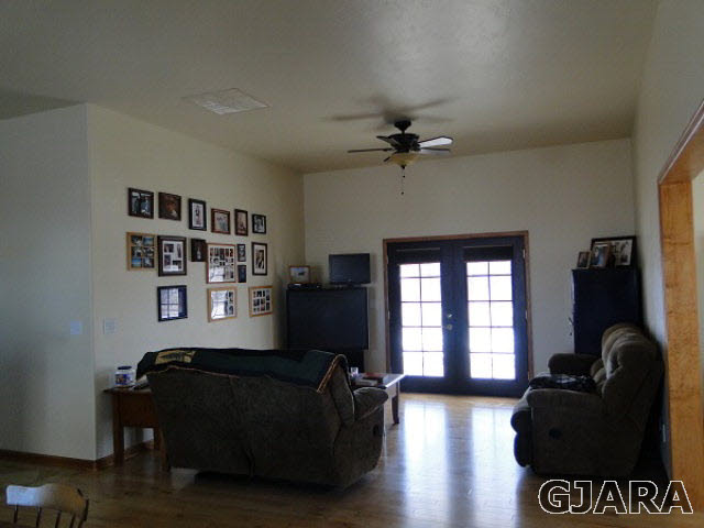 2501 Riata Ranch Road Grand Junction, CO 81505 - Photo 2 of 16 a living room with furniture and a window