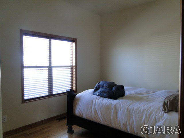 2501 Riata Ranch Road Grand Junction, CO 81505 - Photo 10 of 16 a bedroom with a bed and a window