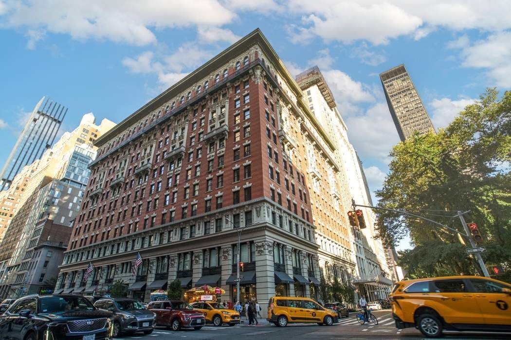 225 5th Avenue, Unit 6R Manhattan, NY 10010 - Photo 7 of 8 a front view of a building and car parked