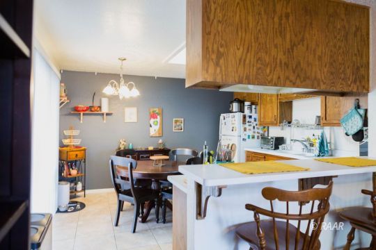 220 South Gemstone Street Ridgecrest, CA 93555 - Photo 3 of 12 a view of a dining room with furniture and chandelier