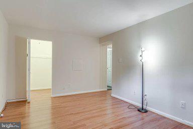 11232 Chestnut Grove Square, Unit 20 Reston, VA 20190 - Photo 28 of 40 a view of empty room with wooden floor