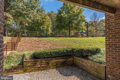 11232 Chestnut Grove Square, Unit 20 Reston, VA 20190 - Photo 37 of 40 a view of a back yard from a balcony