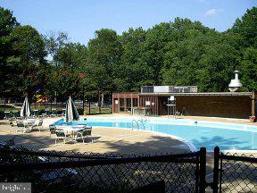 11232 Chestnut Grove Square, Unit 20 Reston, VA 20190 - Photo 5 of 40 a view of a house with pool