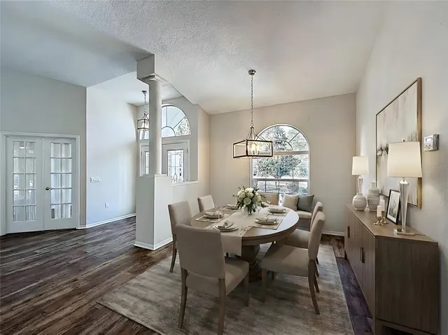 a view of a dining room with furniture window and wooden floor