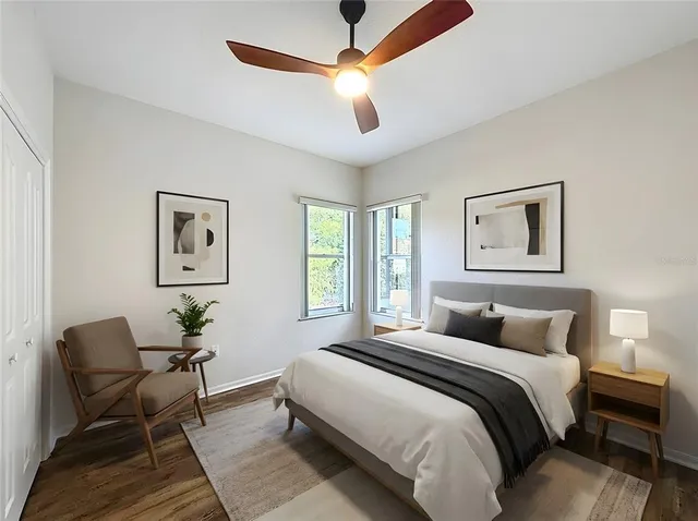 a bedroom with a bed and chair