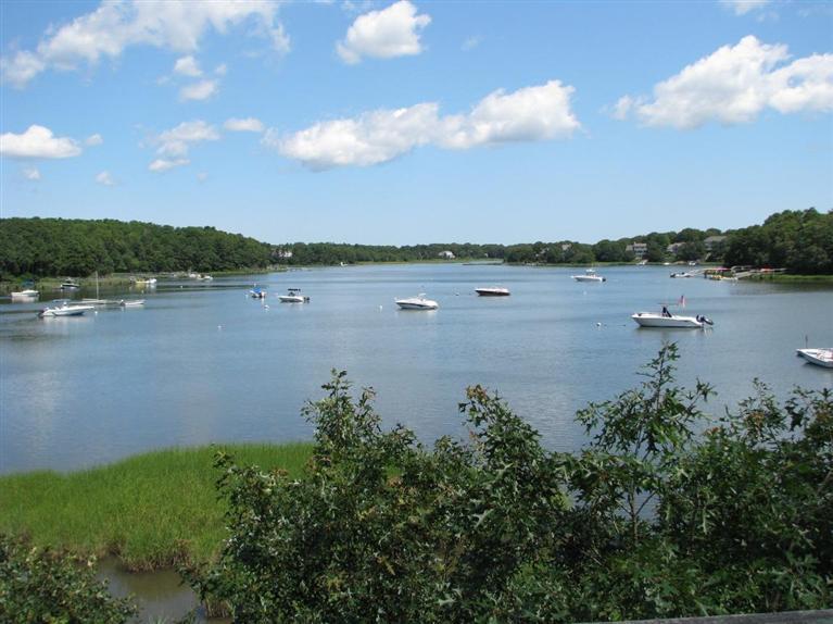 4 Summersea Road Mashpee, MA 02649 - Photo 1 of 16 a view of a lake from a yard