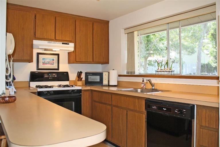 4 Summersea Road Mashpee, MA 02649 - Photo 5 of 16 a kitchen with a sink a stove and a microwave