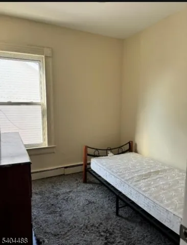 a room with a bed and a window