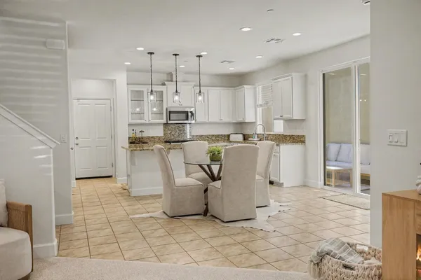 a kitchen with stainless steel appliances a refrigerator sink and cabinets