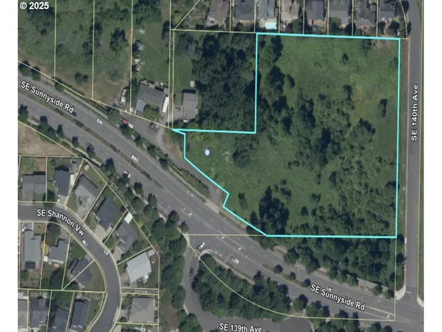 an aerial view of a residential houses with yard