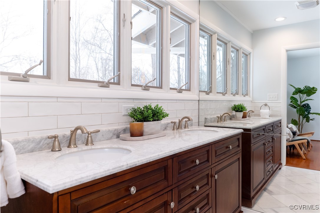 4682 Arrowhead Road Richmond, VA 23235 - Photo 33 of 50 a sink with a granite countertop window and white cabinets