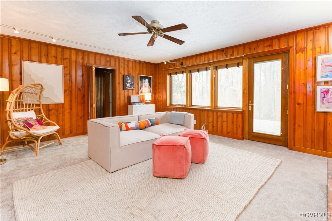 4682 Arrowhead Road Richmond, VA 23235 - Photo 38 of 50 a living room with furniture a ceiling fan and a window