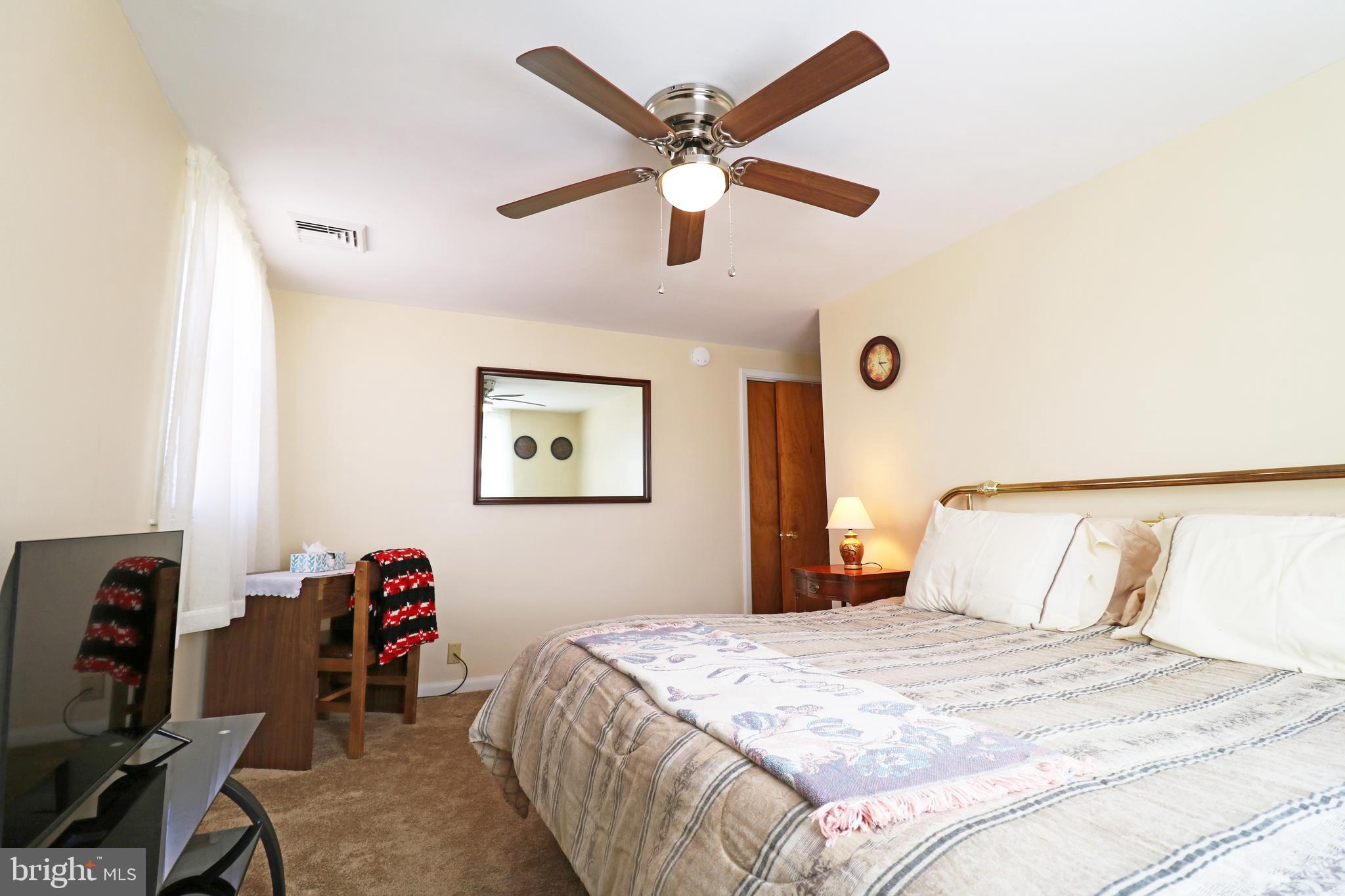 716 Cambridge Road Brookhaven, PA 19015 - Photo 18 of 42 a bedroom with bed and a chandelier