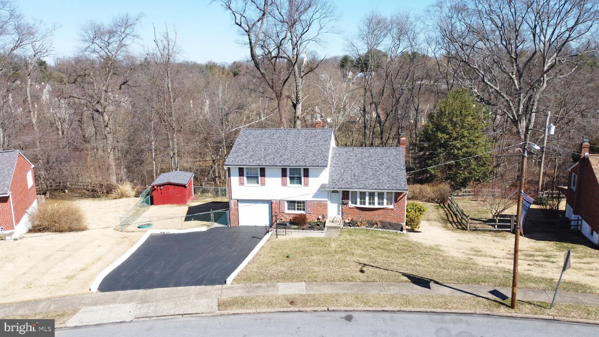 716 Cambridge Road Brookhaven, PA 19015 - Photo 2 of 42 a view of a house with snow on the road