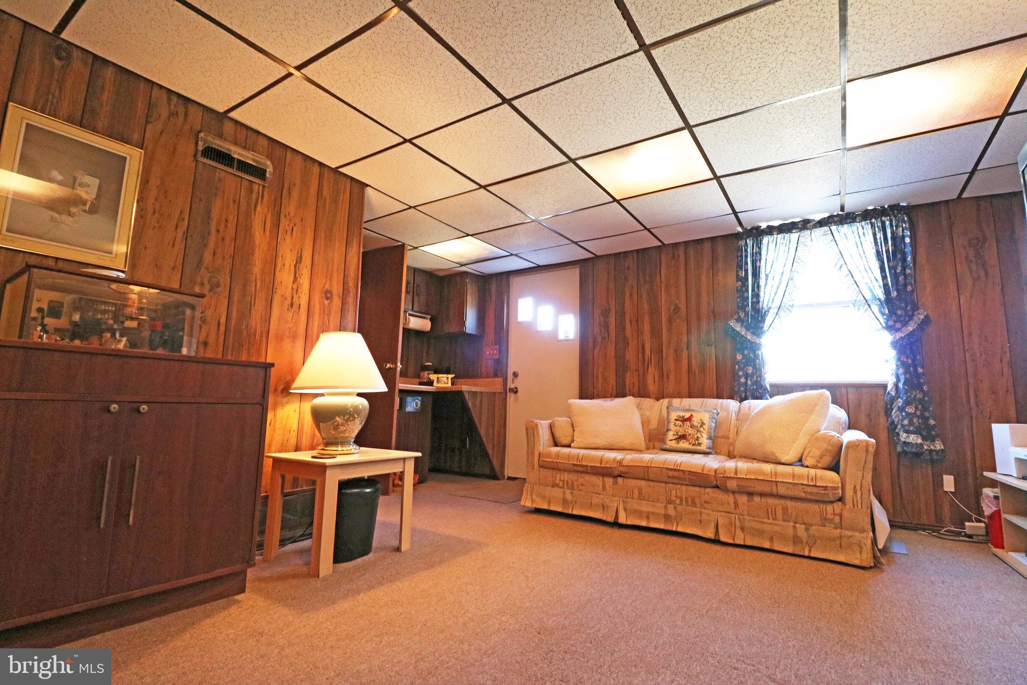 716 Cambridge Road Brookhaven, PA 19015 - Photo 30 of 42 a living room with furniture and a large window