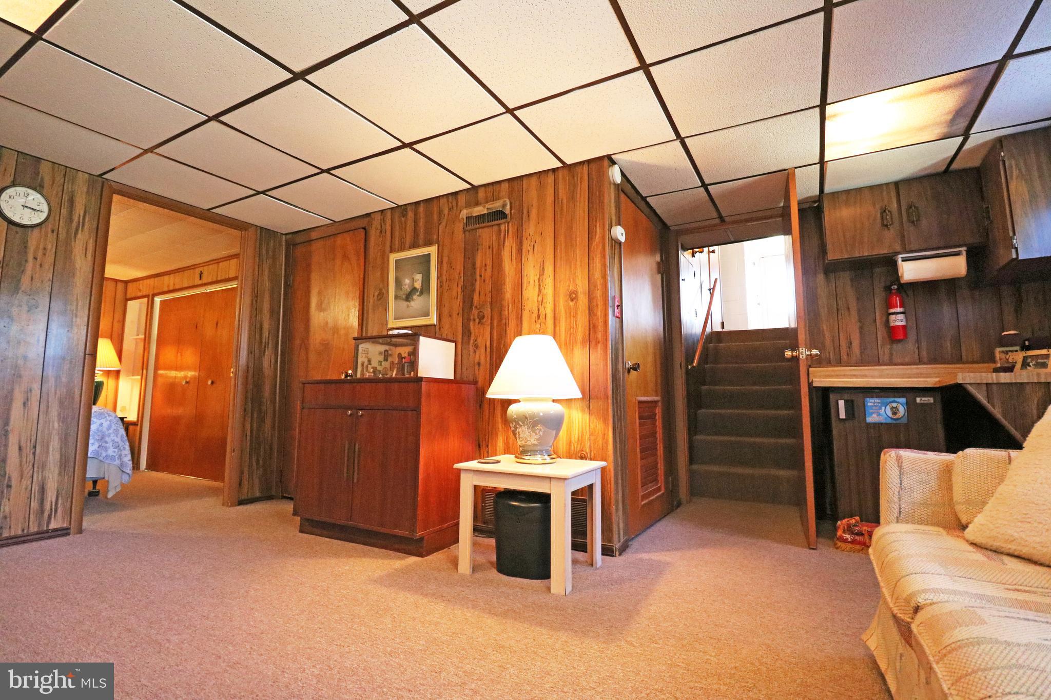 716 Cambridge Road Brookhaven, PA 19015 - Photo 31 of 42 a living room with furniture a ceiling fan and a window