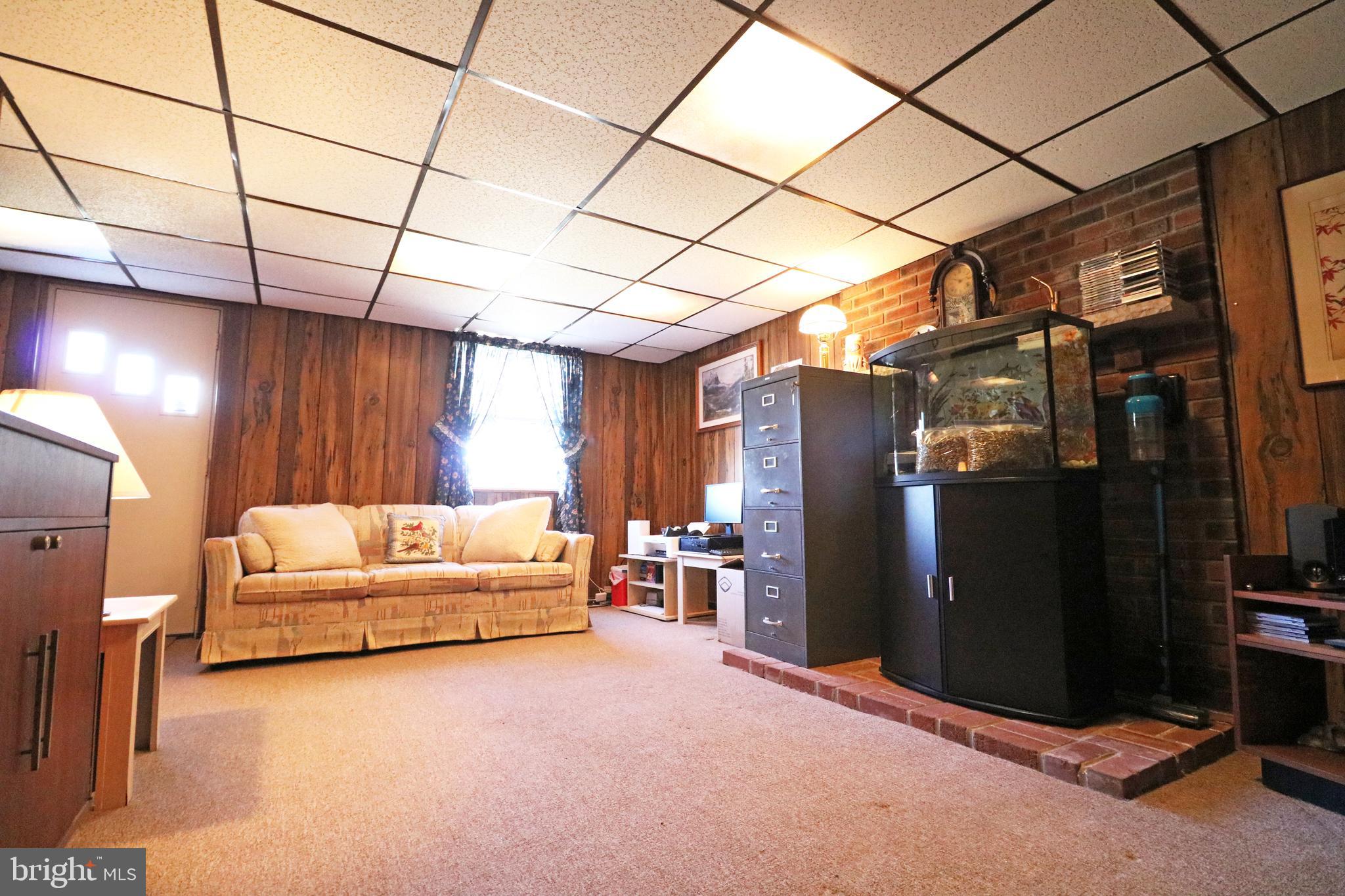 716 Cambridge Road Brookhaven, PA 19015 - Photo 32 of 42 a living room with furniture and a window