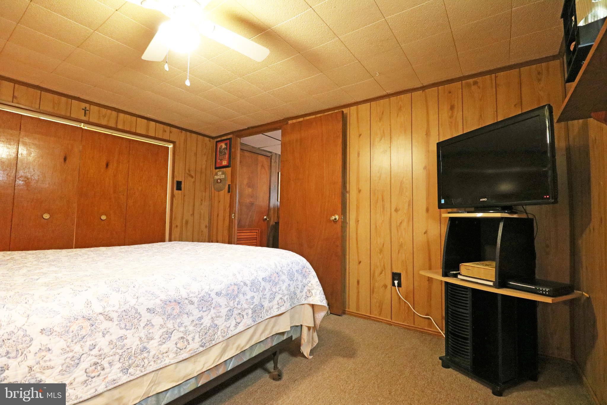 716 Cambridge Road Brookhaven, PA 19015 - Photo 35 of 42 a bedroom with a bed and a flat screen tv