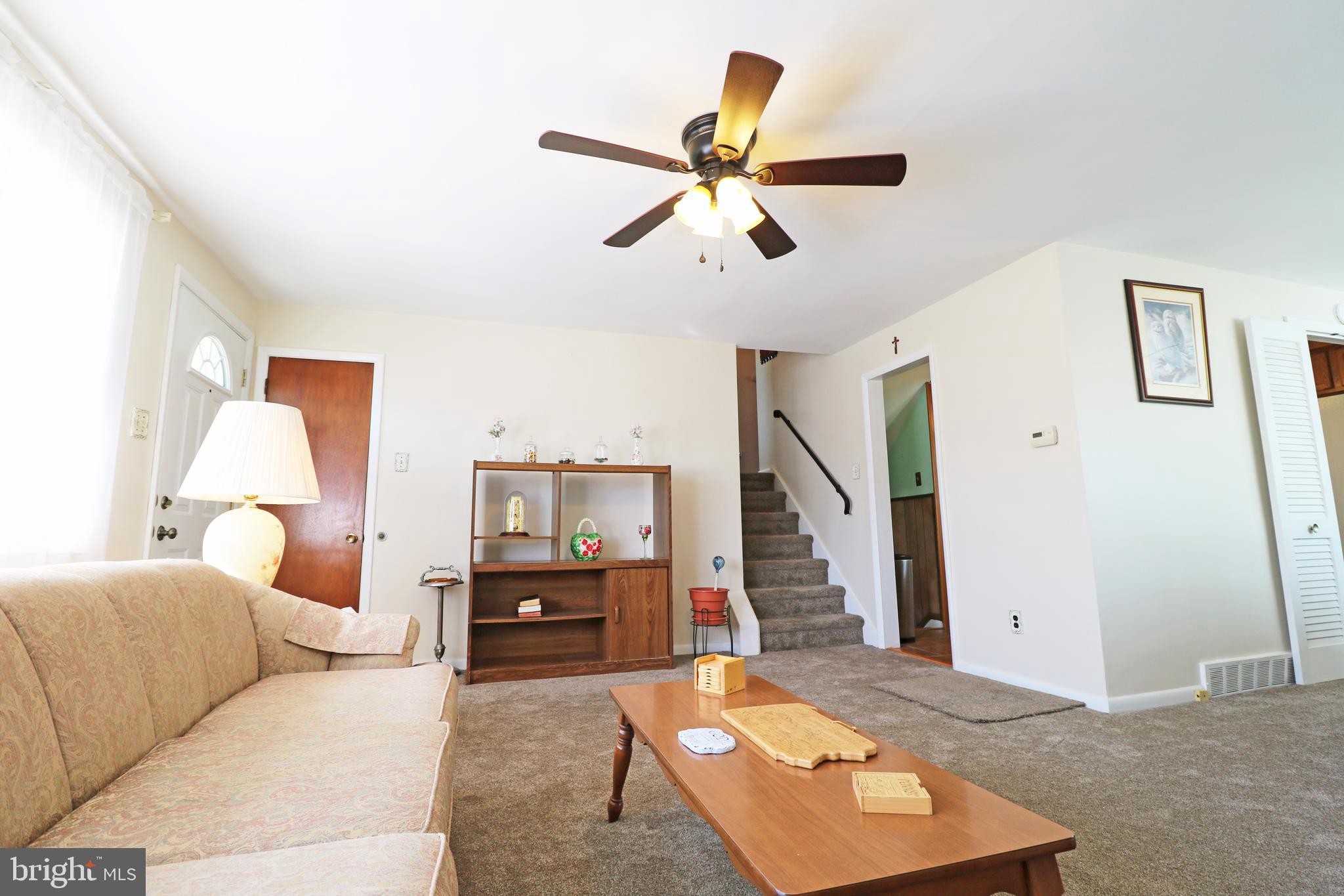 716 Cambridge Road Brookhaven, PA 19015 - Photo 6 of 42 a living room with furniture and a wooden floor