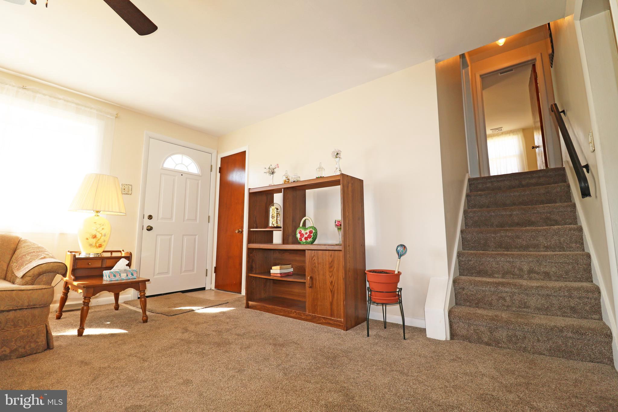 716 Cambridge Road Brookhaven, PA 19015 - Photo 7 of 42 a view of a livingroom with furniture and staircase